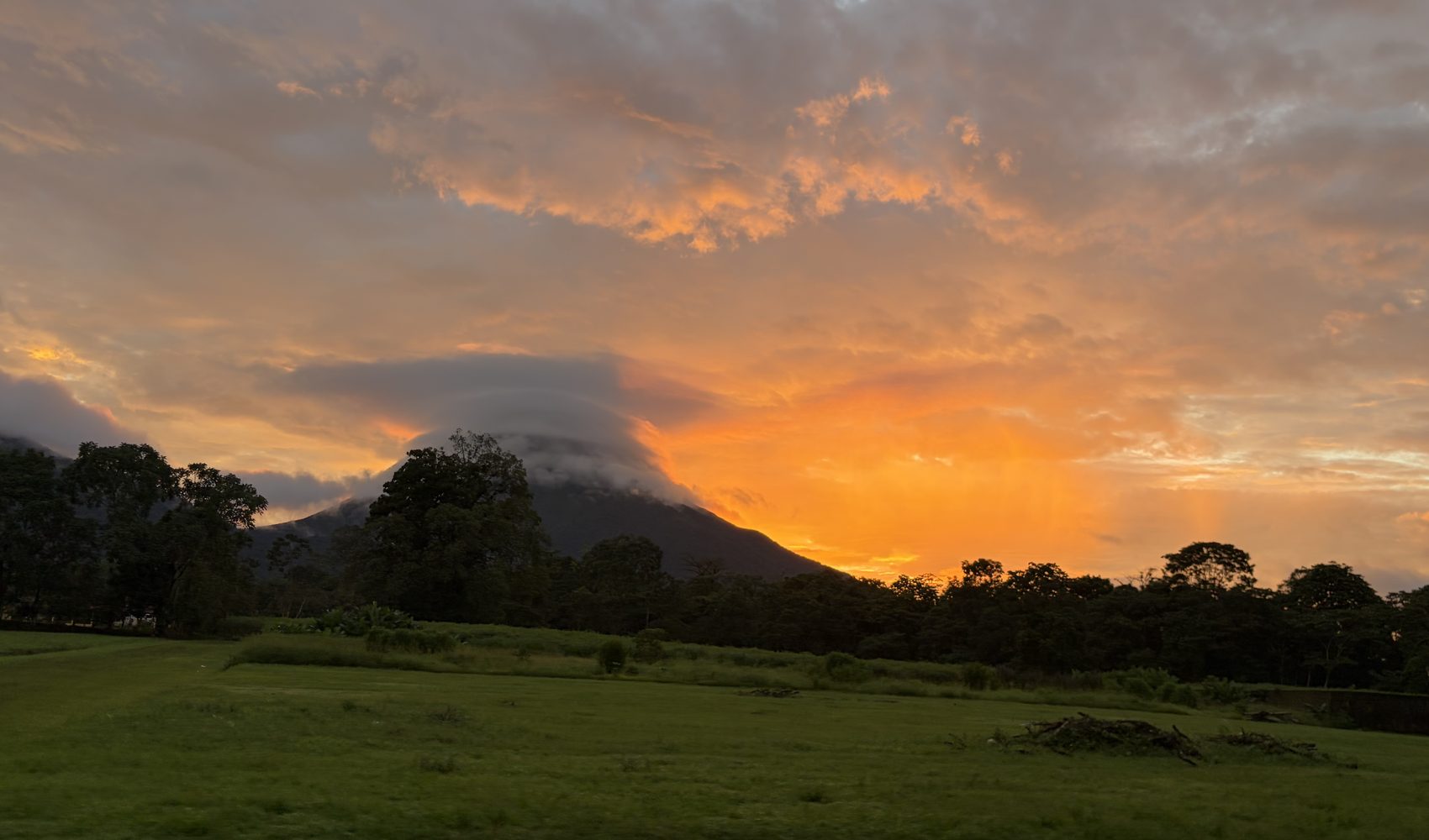 the arenal volcano at sunset