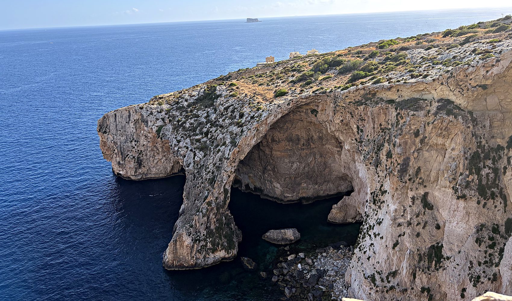 the rugged cliffs of the blue grotto on malta's southern coast