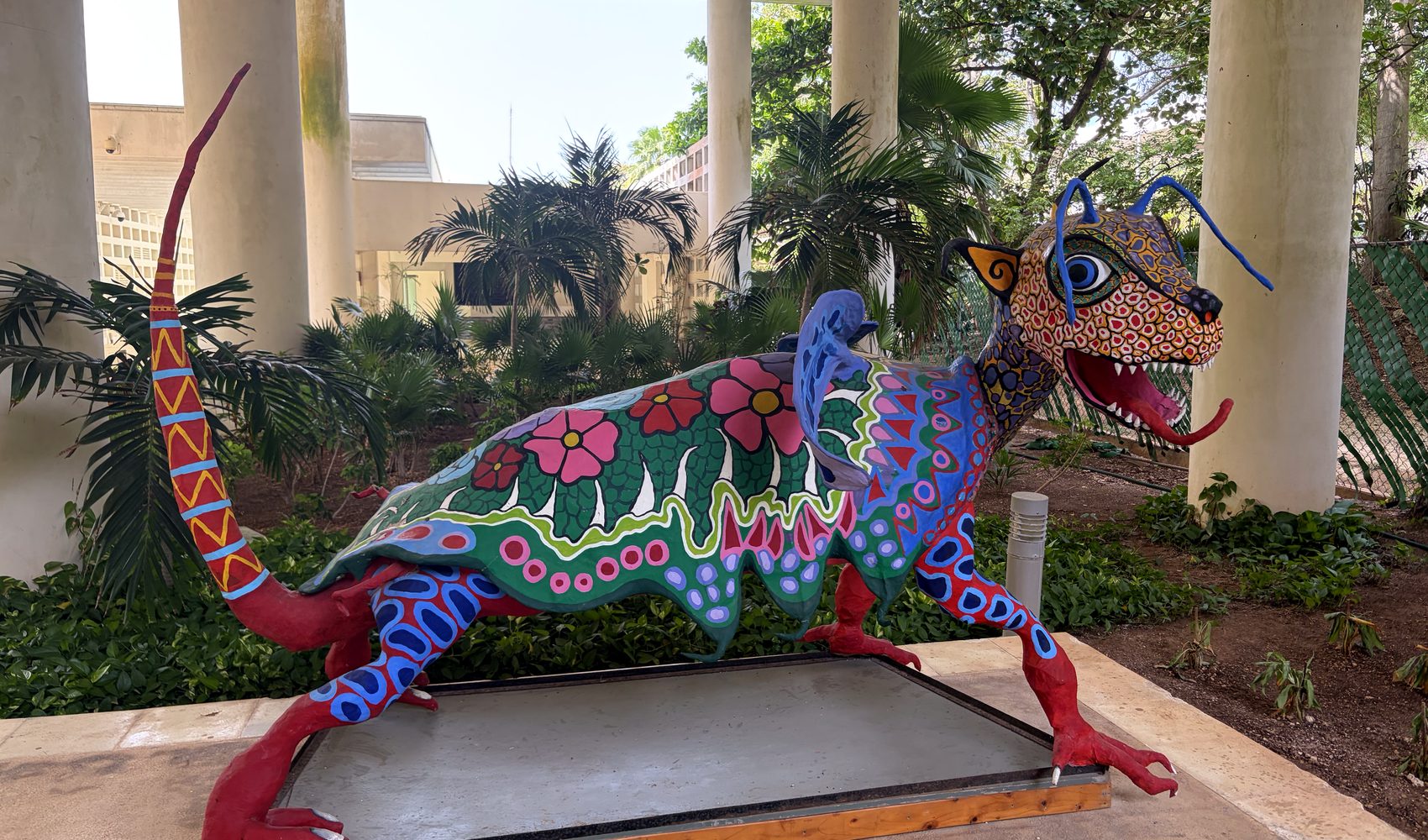 a colourful alebrije sculpture of a jaguar in cancún