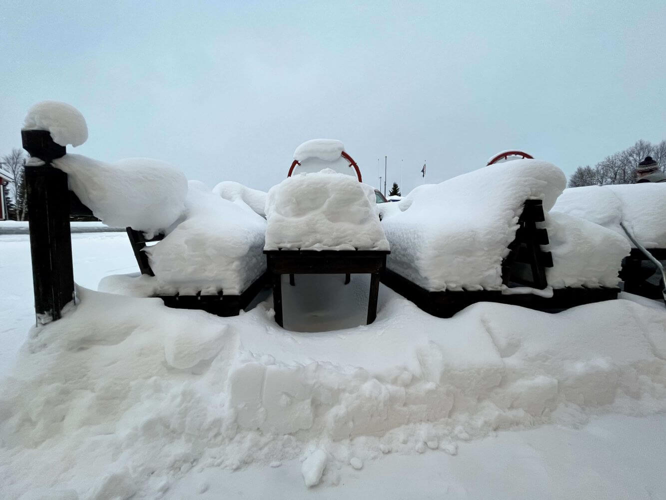 picnic table covered with snow in sweden