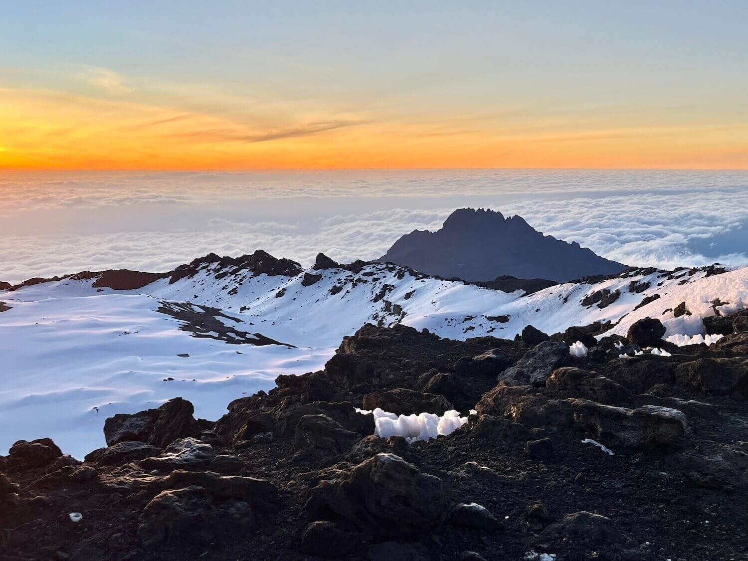 view of sea of clouds from uhuru peak on kilimanjaro