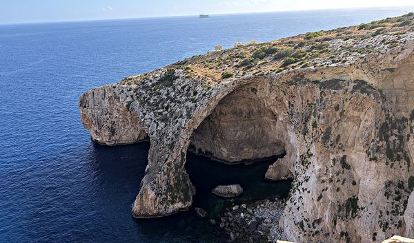 the rugged cliffs of the blue grotto on malta's southern coast